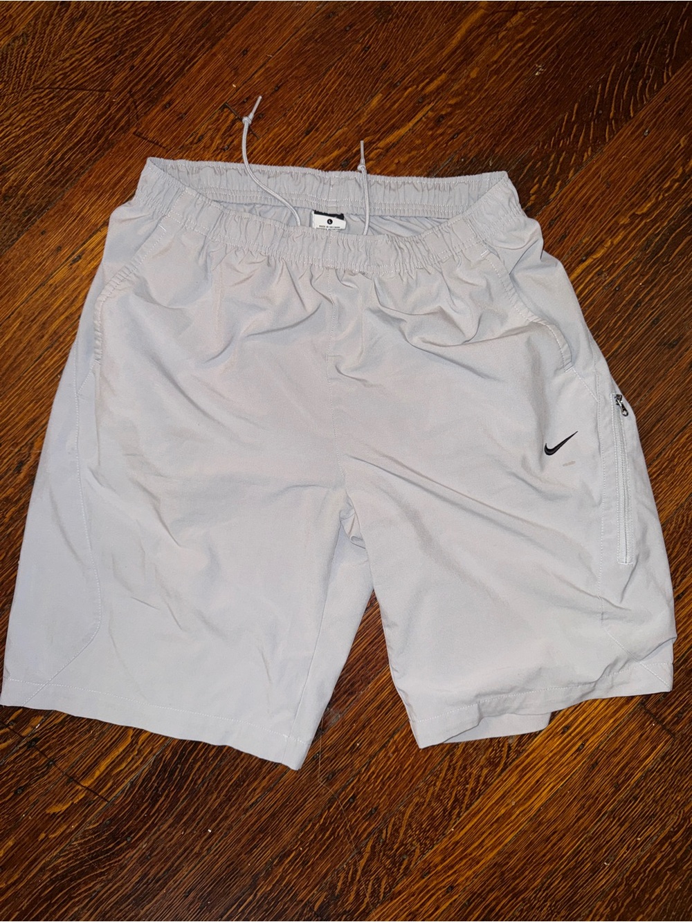 Nike Men’s Light Gray Athletic Shorts with Elastic Waist and Zip Pocket